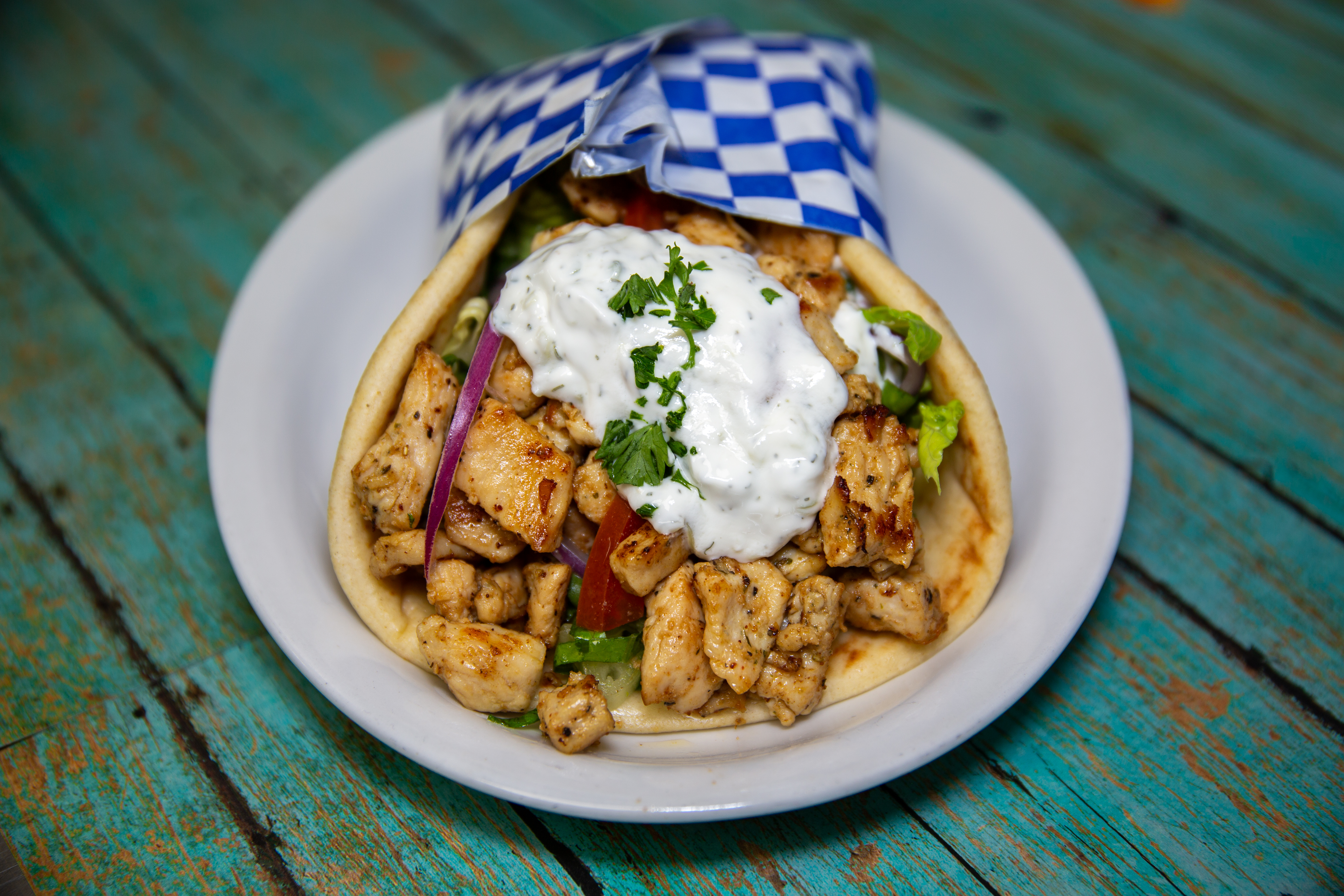 Authentic chicken pita with grilled chicken, fresh vegetables, and tzatziki sauce at Yanni's Gyros