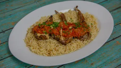 Grilled lamb chops with tomato sauce and rice pilaf at Yanni's Gyros