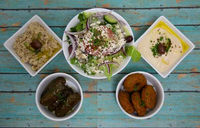 Vegetarian combo platter with Greek salad, hummus, babaganoush, dolmades, and falafel at Yanni's Gyros